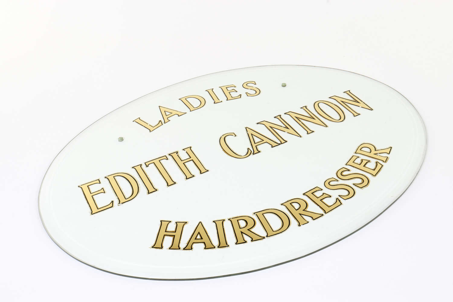 'Edith Cannon - Ladies Hairdresser' glass sign